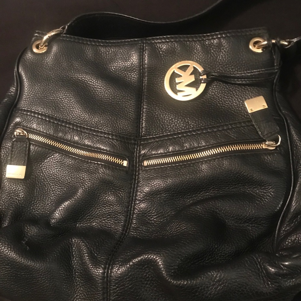 Black Michael Kors handbag with gold accents